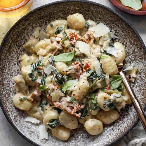 Tuscan gnocchi - pan-seared gnocchi, chicken, mushrooms, sundried tomato, basil, and parmesan cream