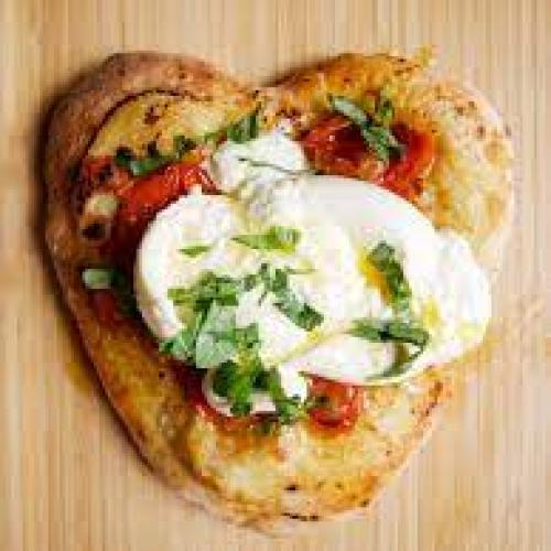 Woodfire-baked garlic bread with mozzarella and sundried tomato
