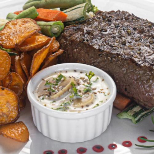 Grilled beef steak with mushroom cream sauce at TUNA TUNA 33